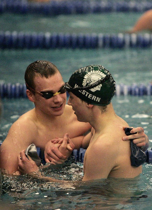 Djamila Grossman  |  The Salt Lake Tribune

The Mountain Crest High School's William Watts shakes hands with Olympus High School's Shawn Western after winning the 200 Yard Freestyle of the 4A Swimming Championship at Brigham Young University, Friday, Feb. 4, 2010.