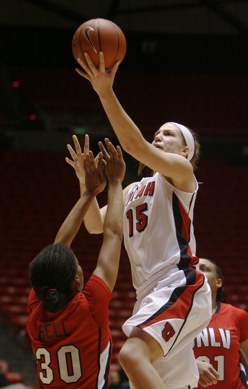 Steve Griffin  |  The Salt Lake Tribune
 
 Utah's Michelle Plouffe scoops the ball over UNLV's Mia Bell during first half action in the Utah versus UNLV women's basketball game at the Huntsman Center in Salt Lake City Tuesday, February 1, 2011.