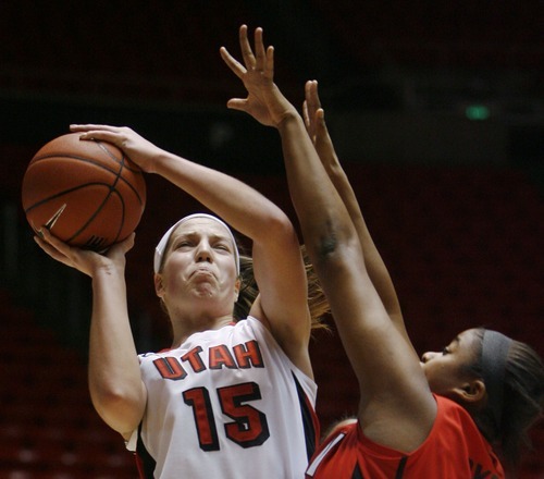 Steve Griffin  |  The Salt Lake Tribune
 
 Utah's Michelle Plouffe powers her way past  UNLV' Ta'Nitra Byrd during first half action in the Utah versus UNLV women's basketball game at the Huntsman Center in Salt Lake City Tuesday, February 1, 2011.
