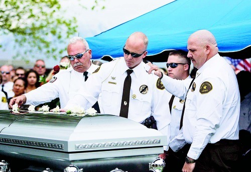Trent Nelson  |  The Salt Lake Tribune
John Hunt (right) puts his arm on Brandt Deaton as officers from the Sevier County Sheriff's department pay their respects at services for Franco Aguilar at the American Fork Cemetery Wednesday, May 5, 2010.