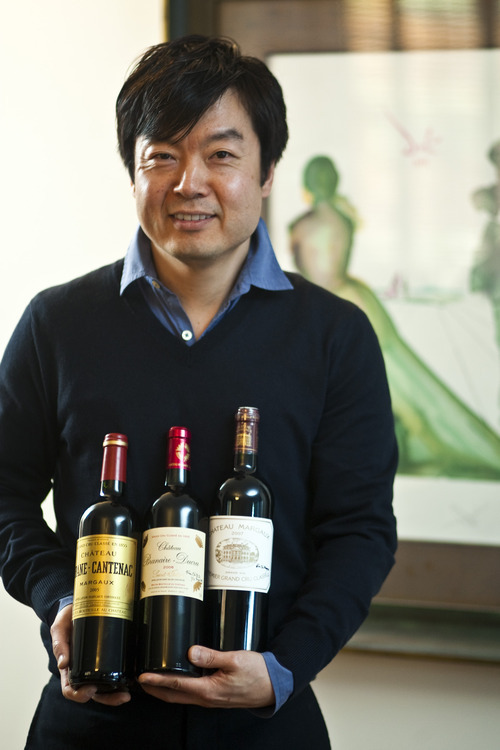 Chris Detrick  |  The Salt Lake Tribune 
Utah Symphony assistant concertmaster David Park poses for a portrait recently with bottles of wine he was given in France. The wines, from left, are 2005 Chateau Brane-Cantenac Margaux, 2006 Chateau Branaire-Ducru Saint-Julien Grand Cru Classe and 2007 Chateau Margaux Premier Grand Cru Classe.