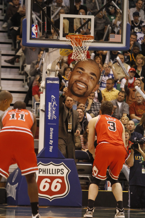 Rick Egan  |  The Salt Lake Tribune

Richard Anderson uses a giant cut out of Carlos Boozer, as he attempts to distract the Bulls' Omer Asik, as he shoots a foul shot, in NBA action Utah vs. Chicago, in Salt Lake City, Wednesday, February 9, 2011
