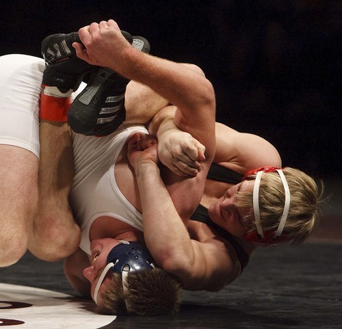 Trent Nelson  |  The Salt Lake Tribune
Aaron Kuttler of East, right, grapples with Joseph Carley of Mountain Crest in the 189lb championship match of the 4A State Wrestling Championships at Utah Valley University in Orem, Utah, Thursday, February 10, 2011. Kuttler won the match.