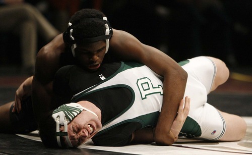 Trent Nelson  |  The Salt Lake Tribune
Brandon McBride of Olympus nearly pins Brady Loveless of Payson in the 171lb championship match of the 4A State Wrestling Championships at Utah Valley University in Orem, Utah, Thursday, February 10, 2011. McBride won the match.