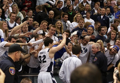 Leah Hogsten  |  The Salt Lake Tribune
BYU guard Jimmer Fredette's  (32) thanks the crowds for their support. Fredette is the leading scorer in the Mountain West Conference with 2,190 points. 
The Brigham Young University Cougars defeated UNLV Saturday, February 5, 2011, in Provo, 78-64 at the Marriott Center.