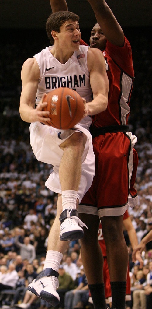 Leah Hogsten  |  The Salt Lake Tribune
BYU guard Jimmer Fredette (32) runs in for a lay up over UNLV forward Quintrell Thomas (1). 
The Brigham Young University Cougars defeated UNLV Saturday, February 5, 2011, in Provo, 78-64 at the Marriott Center.