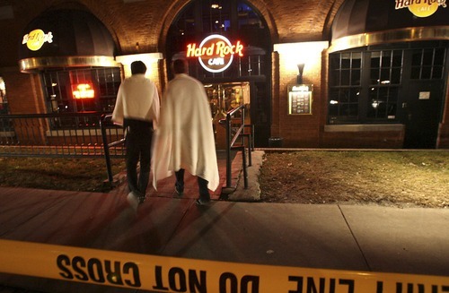 Witnesses wearing blankets head into the Hard Rock Cafe where police were questioning wittnesses after the shootings at Trolly Square.
Ryan Galbraith The Salt Lake Tribune
02.12.07