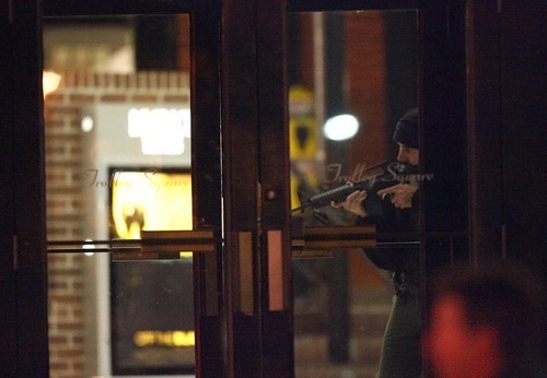 A police officer secures the southern door as other officers search for more possible shooters after an initial shooting in the Trolley Square mall.  Several officers canvassed the east side of the facility with weapons ready.
 Initial reports indicate a gunman opened fire in the Trolley Square Mall.  Police indicate the gunmen is dead.
 photo by Danny Chan La/The Salt Lake Tribune 2-12-2007