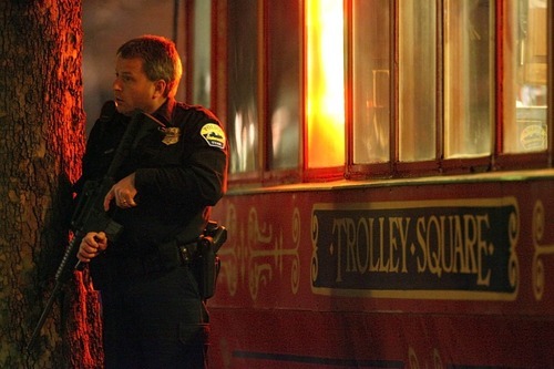 A police officer looks for  more possible shooters after an initial shooting in the Trolley Square mall.  Several officers canvassed the east side of the facility with weapons ready.
 Initial reports indicate a gunman opened fire in the Trolley Square Mall.  Police indicate the gunmen is dead.
 photo by Danny Chan La/The Salt Lake Tribune 2-12-2007