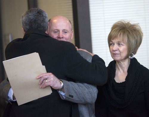 Al Hartmann   |  The Salt Lake Tribune 

Carlos Escueda, assistant U.S. Attorney, left, consoles Richard and Tamara Davis, parents of Kiplyn Davis, as they leave 3rd Distict Courthouse in West Jordan after the verdict on Friday. Defendant Timmy Olsen pleaded guilty to second-degree felony manslaughter in the death of Kiplyn Davis.