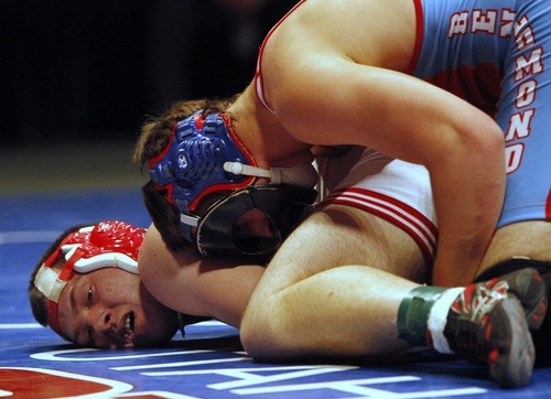 Rick Egan   |  The Salt Lake Tribune

Zach Boden, Ben Lomand (top) wrestles Michael Schena, Delta (bottom) for the 3A state wrestling title, in the 189 weight class, in Orem, Saturday, February 12, 2011.