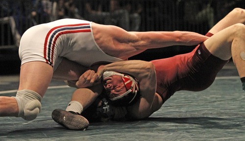 Rick Egan   |  The Salt Lake Tribune

Kyle Foy, Altamont (top) wrestles Maclane Whims, Oakley, for the 1A state wrestling title, in the 171weight class, in Orem, Saturday, February 12, 2011.