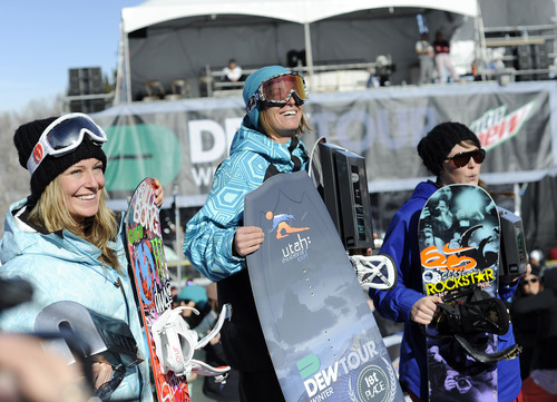 Sarah A. Miller  |  The Salt Lake Tribune

Second place Jamie Anderson	, first place Janna Weatherby and third place Spencer O'Brien stand on the winner's podium for women's snowboard slopestyle during the final day of the Dew Tour at Snowbasin Resort in Huntsville Sunday February 13, 2011.