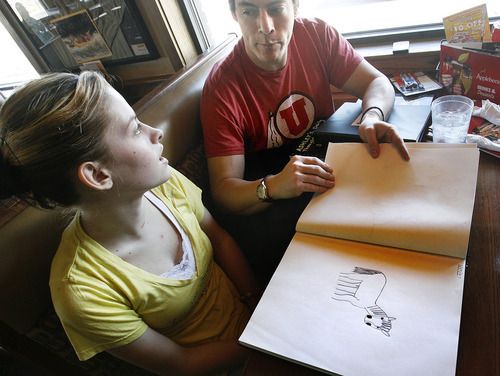 Scott Sommerdorf  |  The Salt Lake Tribune
Ashley Morgan McAdam and her father, Marty Cordova, look at one of Ashley's drawings while at lunch Sunday in South Jordan.