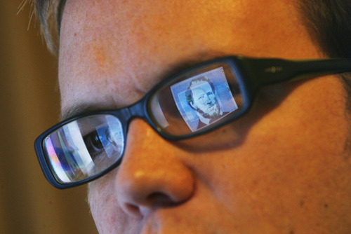 Francisco Kjolseth  |  The Salt Lake Tribune
A graphic image of Brigham Young is reflected in the glasses of artist Matt Page,  explores religious themes with an eye toward parody.