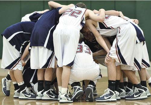 Michael Mangum  |  The Salt Lake Tribune
Waterford forward/center Eric Mika, 33, leads his team in a pregame huddle before prep basketball action at Rowland Hall Upper School in Salt Lake City, Utah on Friday, February 11, 2011.