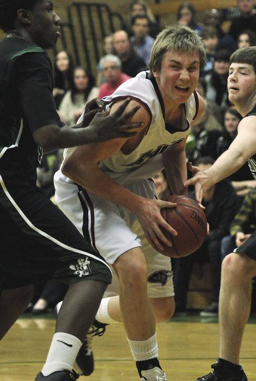 Michael Mangum  |  The Salt Lake Tribune

Waterford forward/center Eric Mika, 33, drives between two Rowland Hall defenders during the first half of prep basketball action at Rowland Hall Upper School in Salt Lake City, Utah on Friday, February 11, 2011.