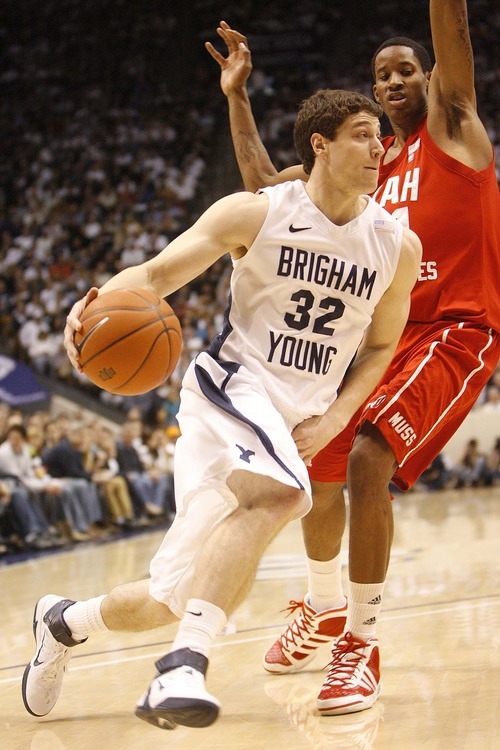 Trent Nelson  |  The Salt Lake Tribune
BYU's Jimmer Fredette drives past Utah's Will Clyburn in the first half at BYU vs. Utah, college basketball in Provo on Saturday, February 12, 2011.
