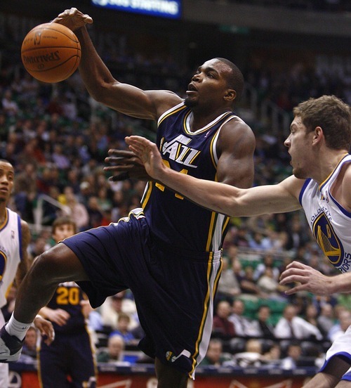 Djamila Grossman  |  The Salt Lake Tribune

The Utah Jazz's Paul Millsap (24) gets blocked by the Golden State Warriors' David Lee (10) during a game in Salt Lake City on Wednesday, Feb.16, 2011. The Jazz lost the game.
