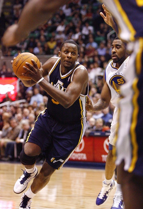 Djamila Grossman  |  The Salt Lake Tribune

The Utah Jazz's C.J. Miles (34) drives to the basket as the Golden State Warriors' Reggie Williams (55) guards him, during a game in Salt Lake City on Wednesday, Feb.16, 2011. The Jazz lost the game.