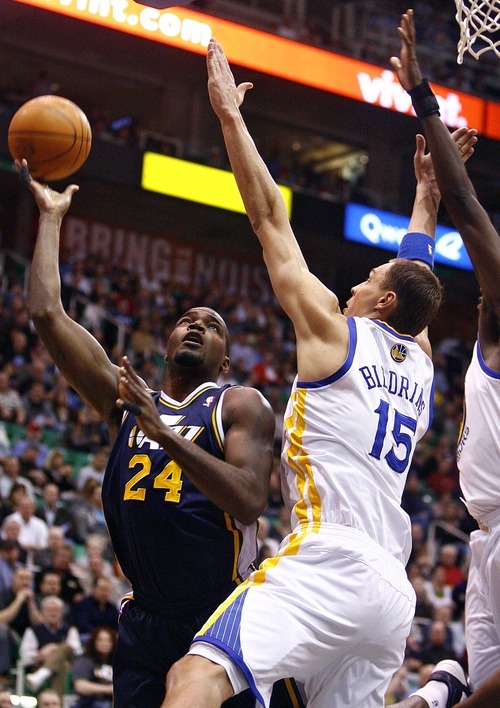Djamila Grossman  |  The Salt Lake Tribune

The Utah Jazz's Paul Millsap (24) gets blocked under the basket by the Golden State Warriors' Andris Biedrins (15) during a game in Salt Lake City on Wednesday, Feb.16, 2011. The Jazz lost the game.