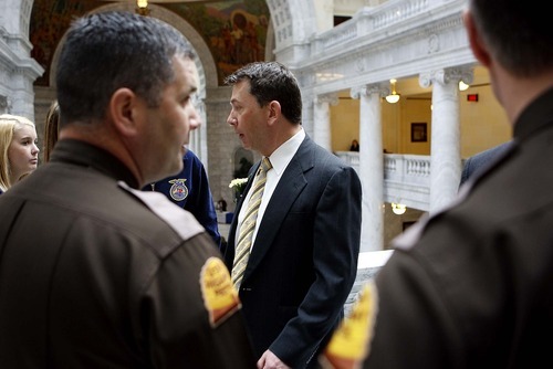 TRENT NELSON  |  The Salt Lake Tribune
Rep. Stephen Sandstrom, is accompanied by two Utah Highway Patrol Troopers, for security, on a recent day at the State Capitol. Sandstrom, R-Orem, and others have been the target of threats and overheated rhetoric over the immigration issue.