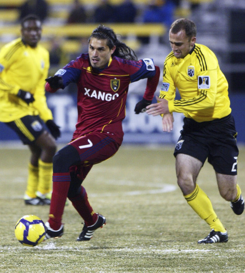 Special to the Tribune

Real Salt Lake's Fabian Espindola, left, escapes the Columbus Crew's Rich Balchan, right, during a CONCACAF Champions League game.