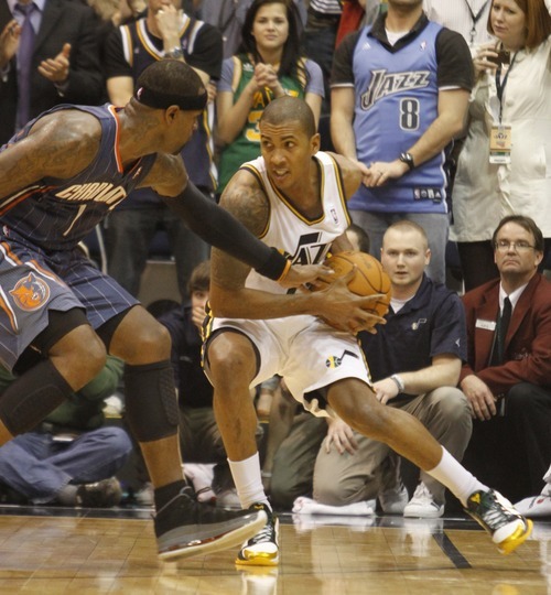 Rick Egan   |  The Salt Lake Tribune

Utah Jazz guard Raja Bell (19) keeps control of the ball in the final minutes of the game,  as Charlotte Bobcats forward Stephen Jackson (1) defends for the Bobcats, in NBA action Utah Jazz vs the Charlotte Bobcats, in Salt Lake City,  Monday, January 31, 2011