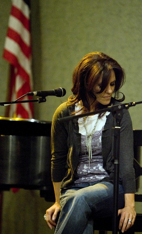 Djamila Grossman  |  The Salt Lake Tribune
Rachelle Call, an LDS songwriter, listens to a singer during 