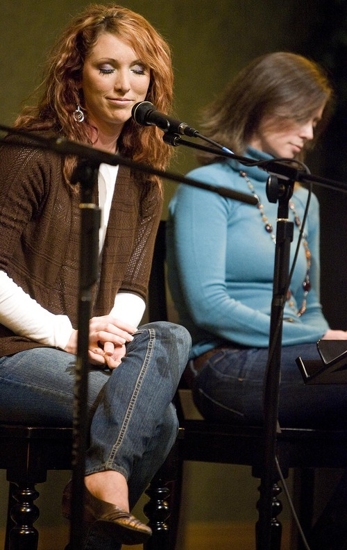 Djamila Grossman  |  The Salt Lake Tribune
Jessie Clark Funk and Nicole Riding listen to a singer during 