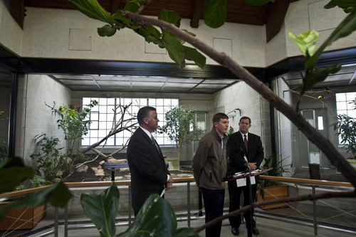 Chris Detrick | The Salt Lake Tribune 
Tom Barton, chairman of Tracy Aviary's board of directors, describes the future of the bird sanctuary during a Wednesday news conference. He is flanked by Salt Lake County Mayor Peter Corroon, left, and Jon Bronson, managing director of Zions Bank Public Finance, who said the county saves thousands of dollars a year in bond payments on such projects because of its solid financial standing.