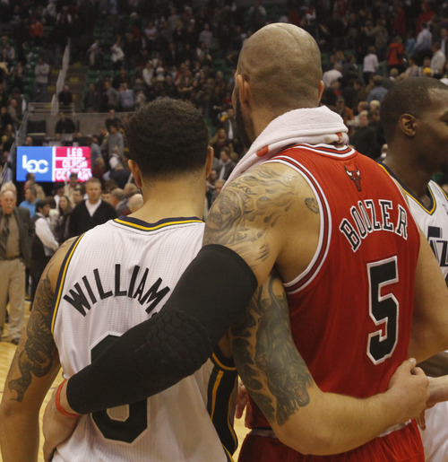 Rick Egan  |  The Salt Lake Tribune

Deron Williams gives Carlos Boozer a hug after the Jazz were defeated by the Bulls, in Salt Lake City, Wednesday, Feb. 9, 2011. Williams is being traded to the New Jersey Nets.