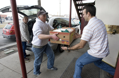 Steve Griffin  |  The Salt Lake Tribune
 
Don HIll, right, house manager at The Rescue Mission of Salt Lake, gets help from Christopher Betz, center,  and Troy Tefertiller as they unload donated food from the Road Home's minivan Tuesday, Feb. 22, 2011.