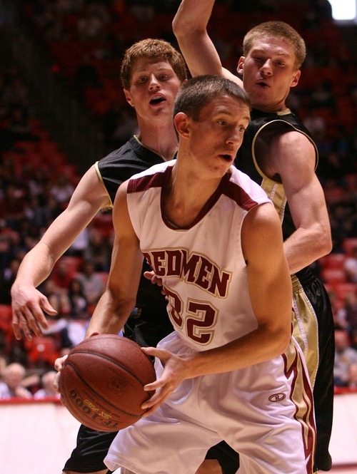 Leah Hogsten  |  The Salt Lake Tribune
Cedar's Kyler Nielson is pressured by Wasatch's Mike Brown (right) and Keefer Babbit. 
 Wasatch High School defeated  Cedar High School 53-43 during their 3A High School Championship quarterfinals at the Jon M. Huntsman Center on the University of Utah campus on Thursday, Feb. 24, 2011.