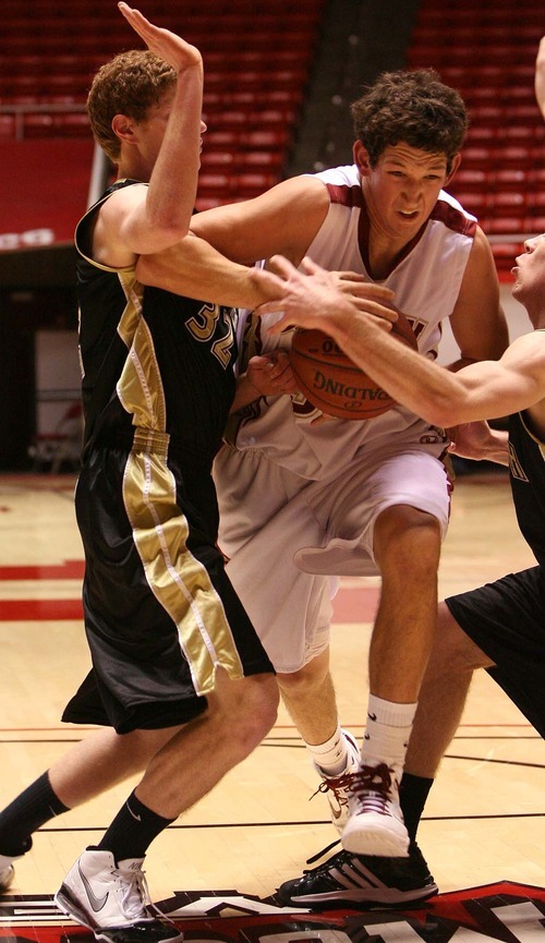 Leah Hogsten  |  The Salt Lake Tribune
Wasatch's Keefer Babbit and Mike Brown block Cedar's Chance Bearnson. 
 Wasatch High School defeated  Cedar  High School 53-43 during their 3A High School Championship quarterfinals at the Jon M. Huntsman Center on the University of Utah campus on Thursday, Feb. 24, 2011.