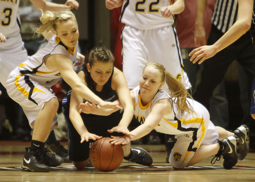 Rick Egan   |  The Salt Lake Tribune

 Miranda Averett (23) Carbon High goes for the ball along with Emery's Blayr Jeffs (5) and Tayler Jewkes (3) in 3A girls state basketball championship game, Carbon vs. Emery, at Huntsman Center, Saturday, February 26, 2011