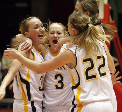 Rick Egan   |  The Salt Lake Tribune

Taylor Mann (33), Tayler Jewkes (3), Jessica Murray (14), and 
Brooke Jensen (22) Emery,  celebrates their win over Carbon,  in 3A girls state basketball championship game, Carbon vs. Emery, at Huntsman Center, Saturday, February 26, 2011