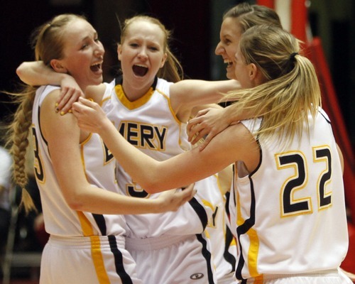 Rick Egan   |  The Salt Lake Tribune

Taylor Mann (33), Tayler Jewkes (3), Jessica Murray (14), and 
Brooke Jensen (22) Emery,  celebrates their win over Carbon,  in 3A girls state basketball championship game, Carbon vs. Emery, at Huntsman Center, Saturday, February 26, 2011