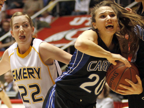 Rick Egan   |  The Salt Lake Tribune

 Tia Pappas (20) Carbon High gets tied up for a jump ball along with  Brooke Jensen ((22) Emery,  in 3A girls state basketball championship game, Carbon vs. Emery, at Huntsman Center, Saturday, February 26, 2011