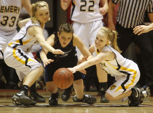 Rick Egan   |  The Salt Lake Tribune

 Miranda Averett (23) Carbon High goes for the ball along with Emery's Blayr Jeffs (5) and Tayler Jewkes (3) in 3A girls state basketball championship game, Carbon vs. Emery, at Huntsman Center, Saturday, February 26, 2011