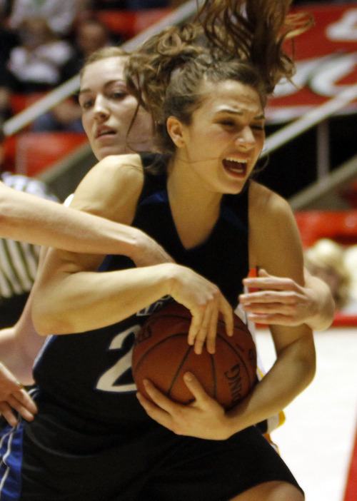 Rick Egan   |  The Salt Lake Tribune

 Tia Pappas (20) Carbon High gets tied up for a jump ball along with  Brooke Jensen ((22) Emery,  in 3A girls state basketball championship game, Carbon vs. Emery, at Huntsman Center, Saturday, February 26, 2011