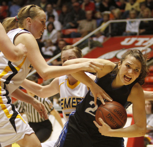 Rick Egan   |  The Salt Lake Tribune

 Tia Pappas (20) Carbon High gets tied up for a jump ball along with  Brooke Jensen ((22) Emery,  in 3A girls state basketball championship game, Carbon vs. Emery, at Huntsman Center, Saturday, February 26, 2011