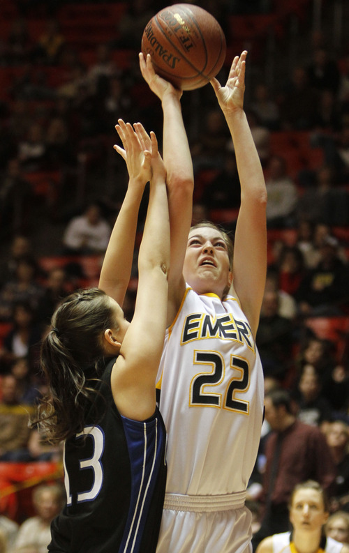 Rick Egan   |  The Salt Lake Tribune

Taylor Mann ((33) Emery, shoots over    Kylee Lessar (11) Carbon High, in 3A girls state championship game, Carbon vs. Emery, at Huntsman Center, Saturday, February 26, 2011