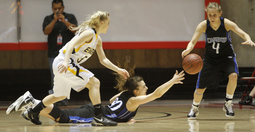 Rick Egan   |  The Salt Lake Tribune

Blayr Jeffs (5) Emery,  goes after the ball, as Tia Pappas (20) Carbon  passes off to  Kristen Jewkes (4) Carbon,  in 3A girls state championship game, Carbon vs. Emery, at Huntsman Center, Saturday, February 26, 2011