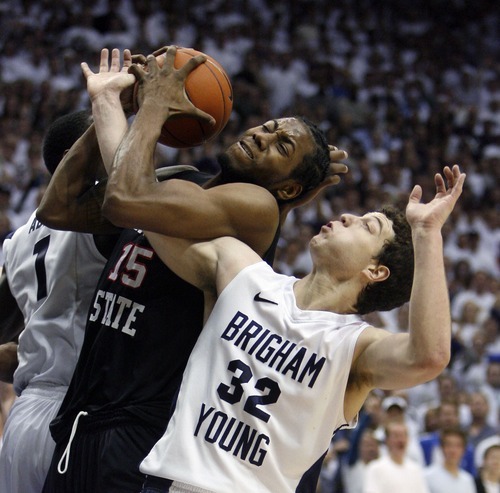Steve Griffin  |  The Salt Lake Tribune
 
BYU guard Jimmer Fredette battles San Diego State forward Kawhi Leonard for the ball during second half action of the BYU versus San Diego State men's basketball game at the Marriott Center in Provo Wednesday, January 26, 2011.