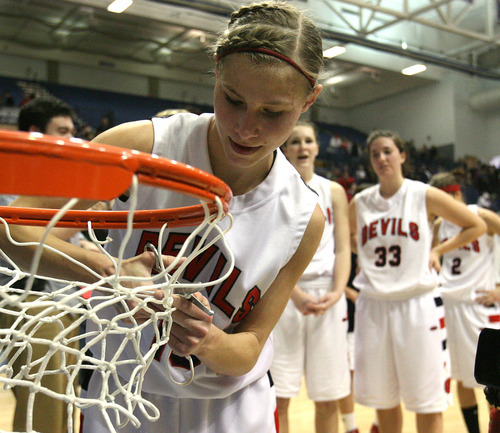 Leah Hogsten  |  The Salt Lake Tribune
Springville's Jennifer Mason celebrates the win and cuts a portion of the net.
Springville High School girls defeated Mountain Crest High School 44-40 for the 4A 2011 High School Championship title at Salt Lake Community College Saturday February 26, 2011
