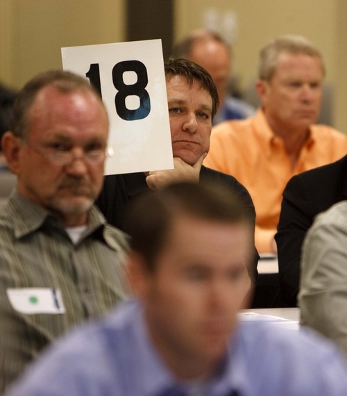 In this 2009 Tribune file photo, Brad Wixon of International Petroleum bids on a parcel during an oil- and gas-lease auction at the Bureau of Land Management office in Salt Lake City.