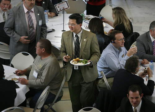 SCOTT SOMMERDORF  |  The Salt Lake Tribune
Rep. Dean Sanpei, R-Provo, looks for a seat at the lunch banquet sponsored Friday by the Utah Realtors Association in the Capitol Rotunda. The group was one of scores that sponsored more than 100 meals and special events for legislators during the lawmaking session.