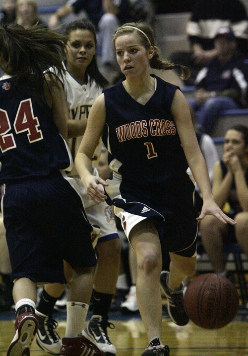 Djamila Grossman  |  The Salt Lake Tribune

Woods Cross High's Erica Anderson, 1, drives the ball toward the basket during a game against Cyprus High School in Magna, Utah, Wednesday, Dec. 22, 2010. Cyprus won the game.