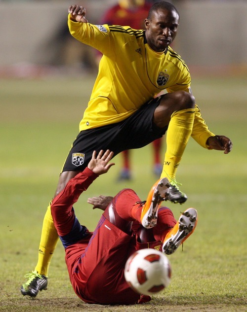 Steve Griffin  |  The Salt Lake Tribune
 
Columbus Crew forward Jeff Cunningham leaps over Real Salt Lake's Andy Williams during first-half action in the CONCACAF Champions League quarterfinal game at Rio Tinto Stadium in Sandy on Tuesday, March 1, 2011.